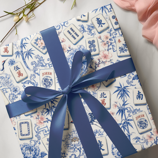chinoiserie mahjong wrapping paper on a gift with a blue bow